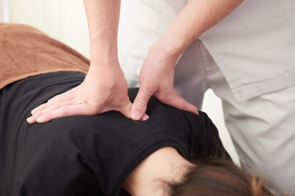 A Japanese woman getting a massage at a seitai clinic